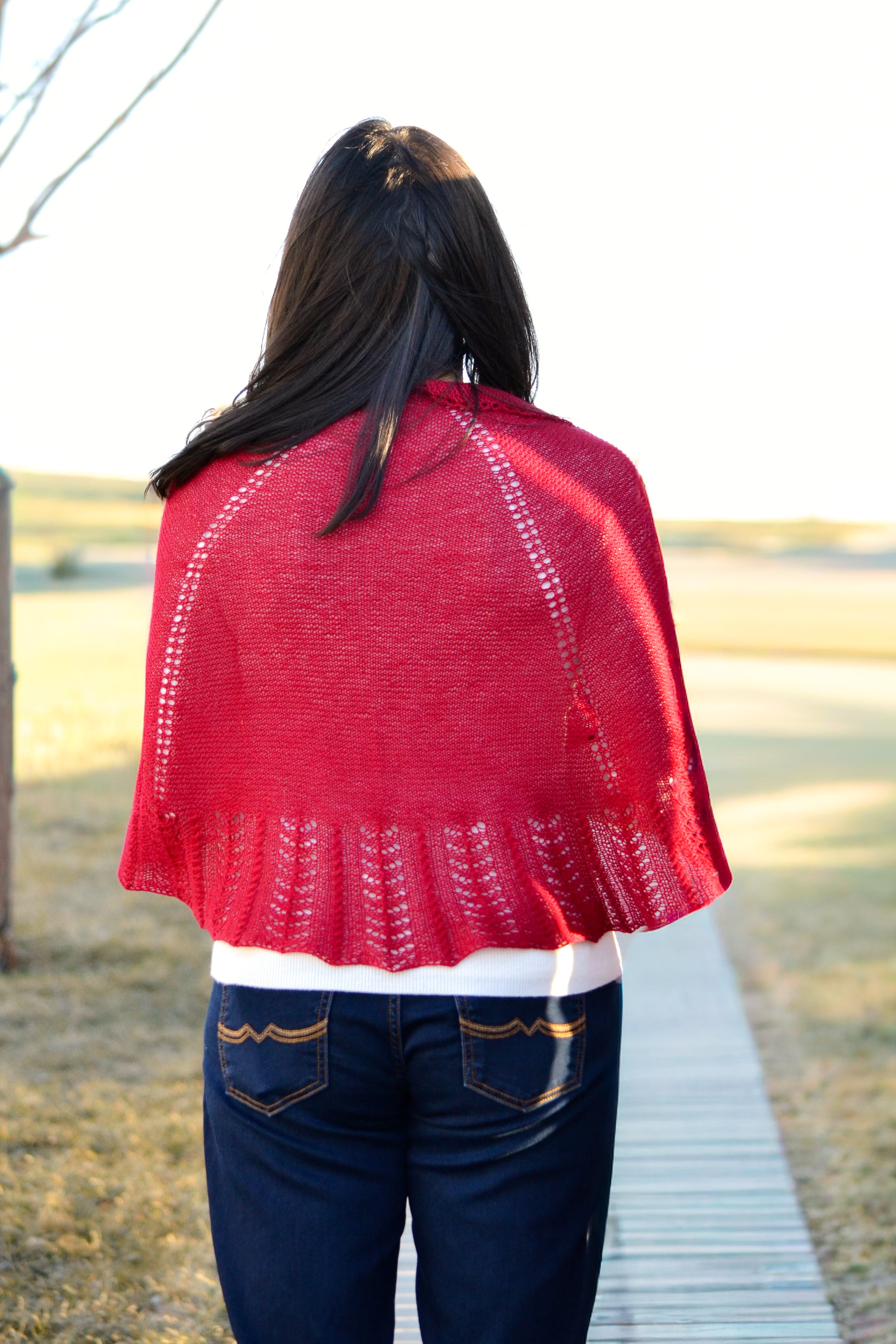 Dramatic hand knit shawl with rich texture and modern styling