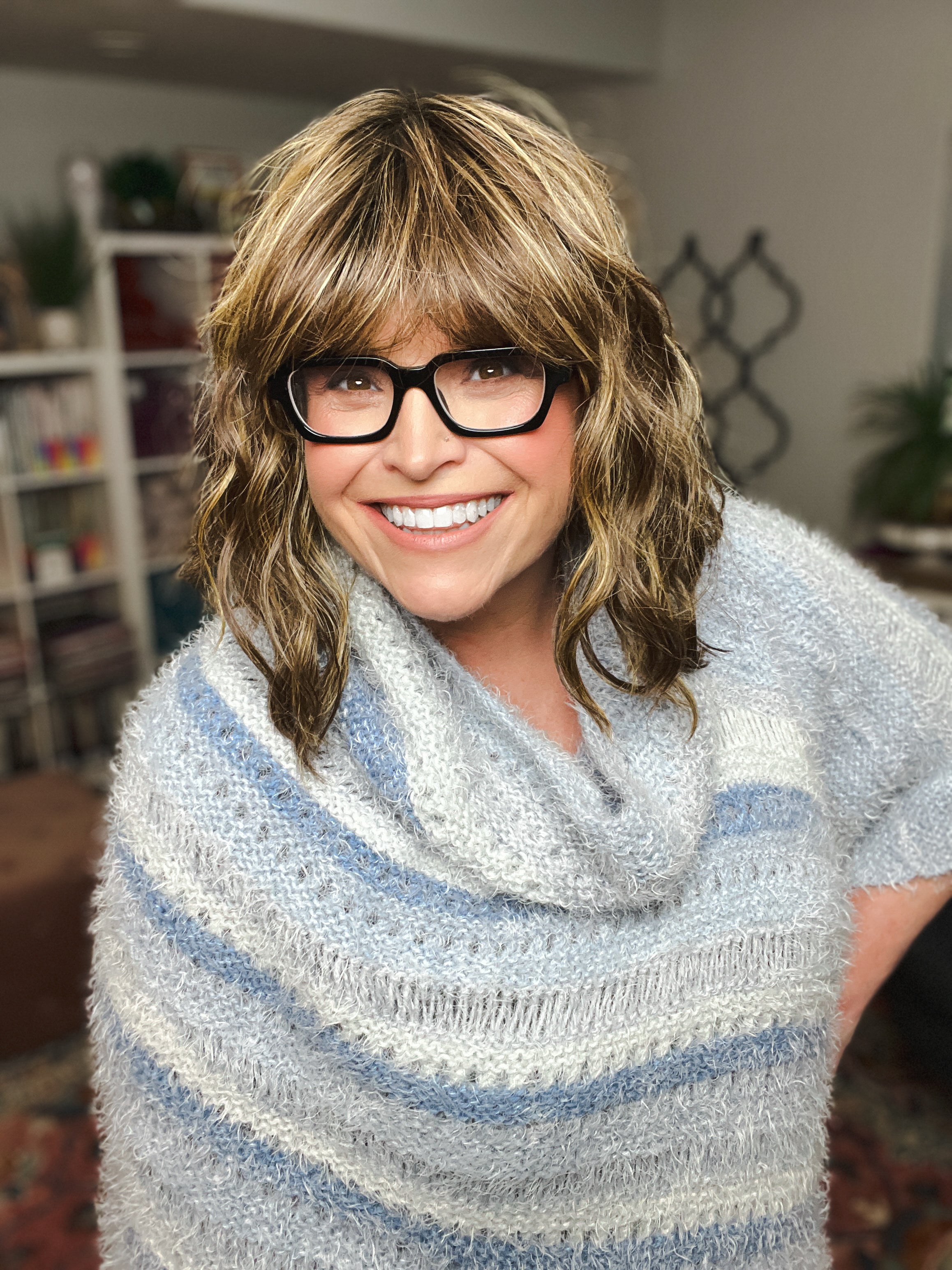 Woman wearing oversized knit poncho with relaxed fit